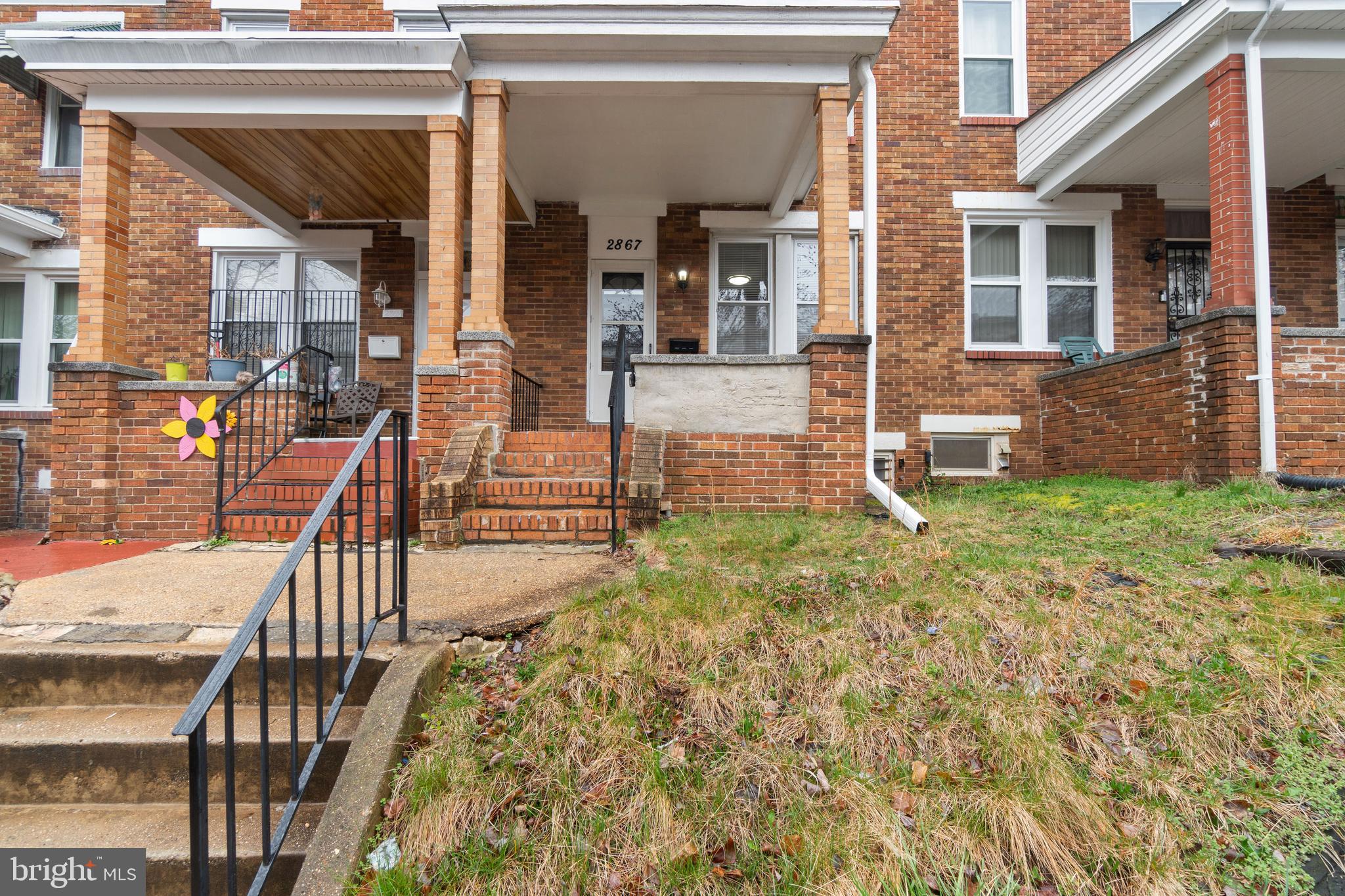 2867 Mayfield Avenue Baltimore, MD 21213 - Photo 2 of 25 front view of a house with a yard