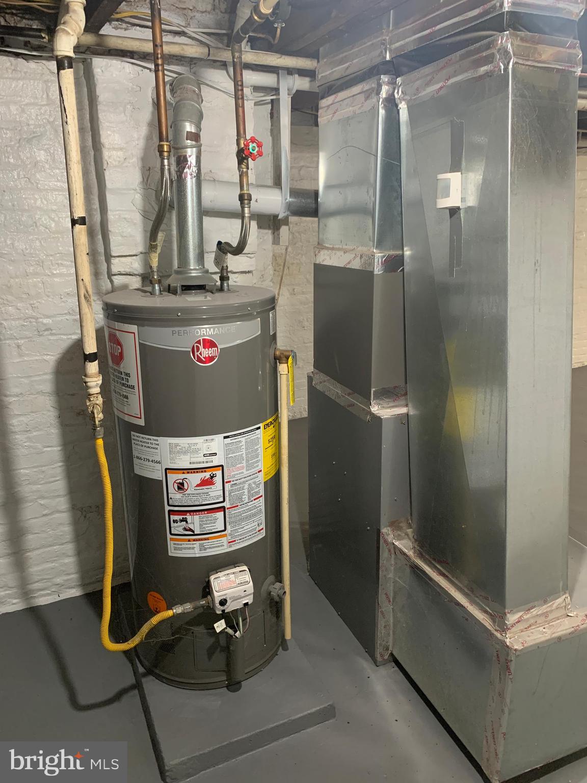 2867 Mayfield Avenue Baltimore, MD 21213 - Photo 21 of 25 a room with water heater and a refrigerator