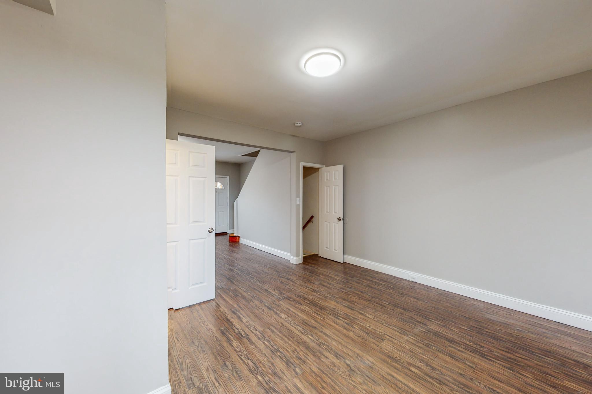 2867 Mayfield Avenue Baltimore, MD 21213 - Photo 9 of 25 a view of empty room with wooden floor