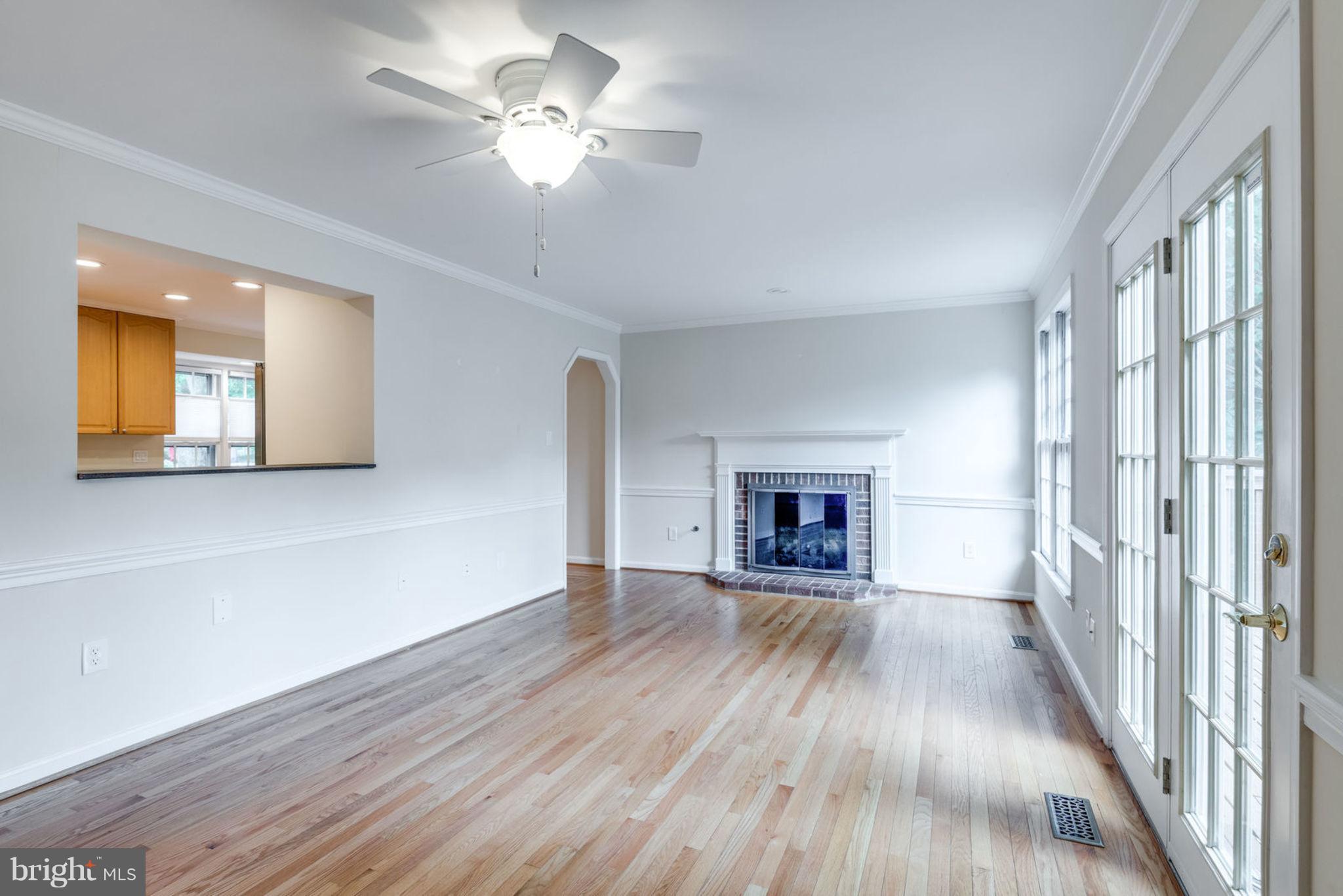 1635 Stowe Road Reston, VA 20194 - Photo 10 of 29 Family Room w/ Gas FP & Kitchen Pass Through