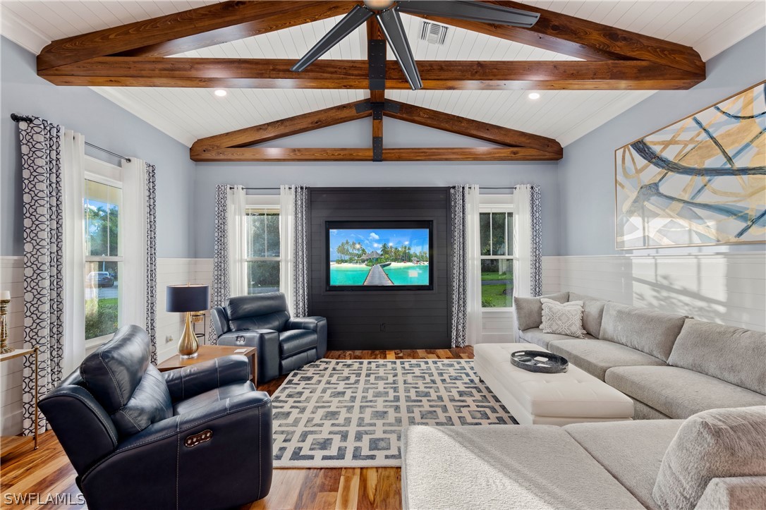 1606 Ardmore Road Fort Myers, FL 33901 - Photo 1 of 33 a living room with furniture a fireplace and a flat screen tv