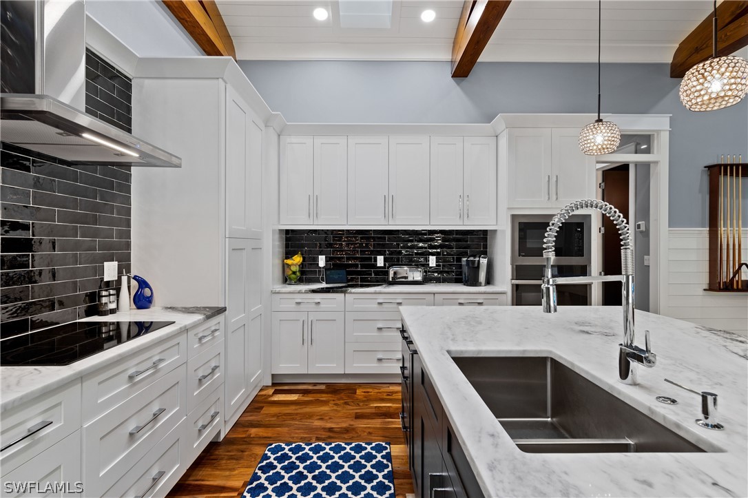 1606 Ardmore Road Fort Myers, FL 33901 - Photo 13 of 33 a kitchen with granite countertop a sink a stove and cabinets