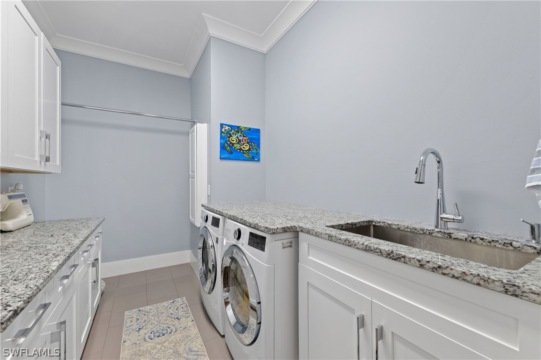 1606 Ardmore Road Fort Myers, FL 33901 - Photo 16 of 33 a utility room with dryer and washer