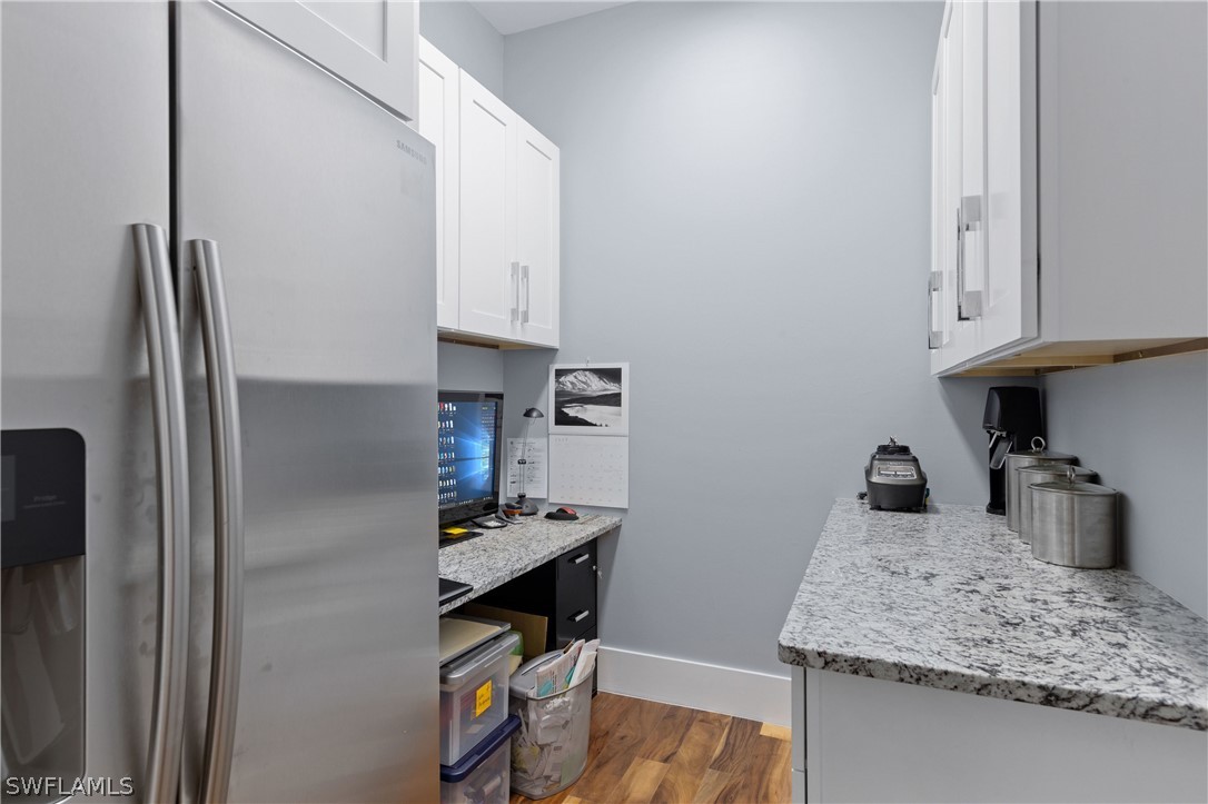 1606 Ardmore Road Fort Myers, FL 33901 - Photo 17 of 33 a kitchen with stainless steel appliances granite countertop a refrigerator and a sink