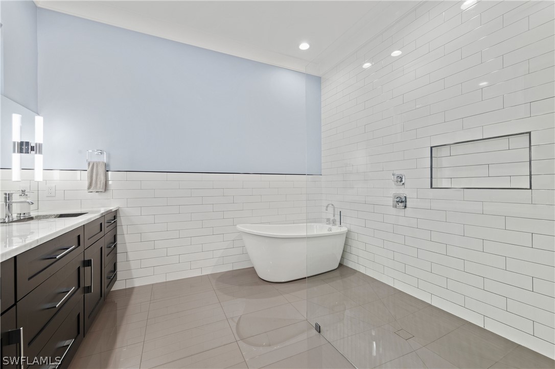 1606 Ardmore Road Fort Myers, FL 33901 - Photo 23 of 33 a bathroom with a bathtub and sink