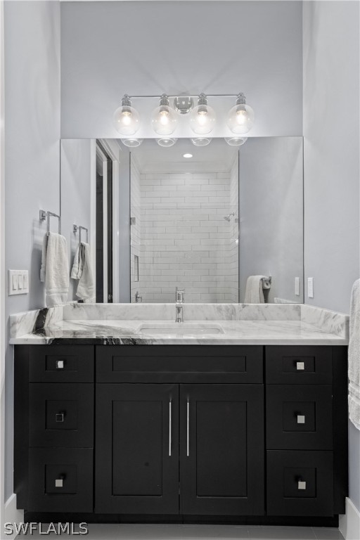 1606 Ardmore Road Fort Myers, FL 33901 - Photo 26 of 33 a bathroom with a double vanity sink and a mirror