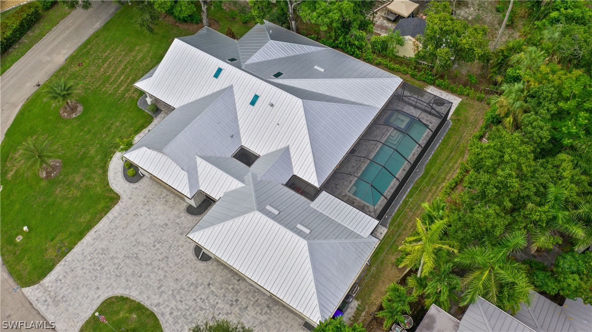 1606 Ardmore Road Fort Myers, FL 33901 - Photo 32 of 33 an aerial view of a house with table and chairs