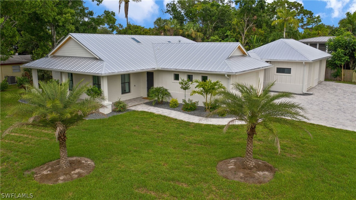 1606 Ardmore Road Fort Myers, FL 33901 - Photo 33 of 33 a front view of a house with garden