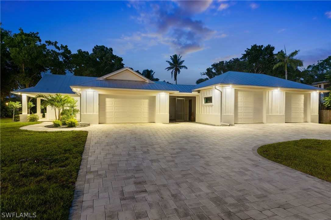 1606 Ardmore Road Fort Myers, FL 33901 - Photo 4 of 33 a front view of a house with a yard