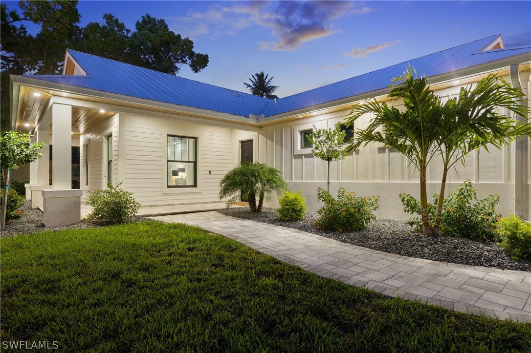 1606 Ardmore Road Fort Myers, FL 33901 - Photo 5 of 33 a front view of a house with a yard