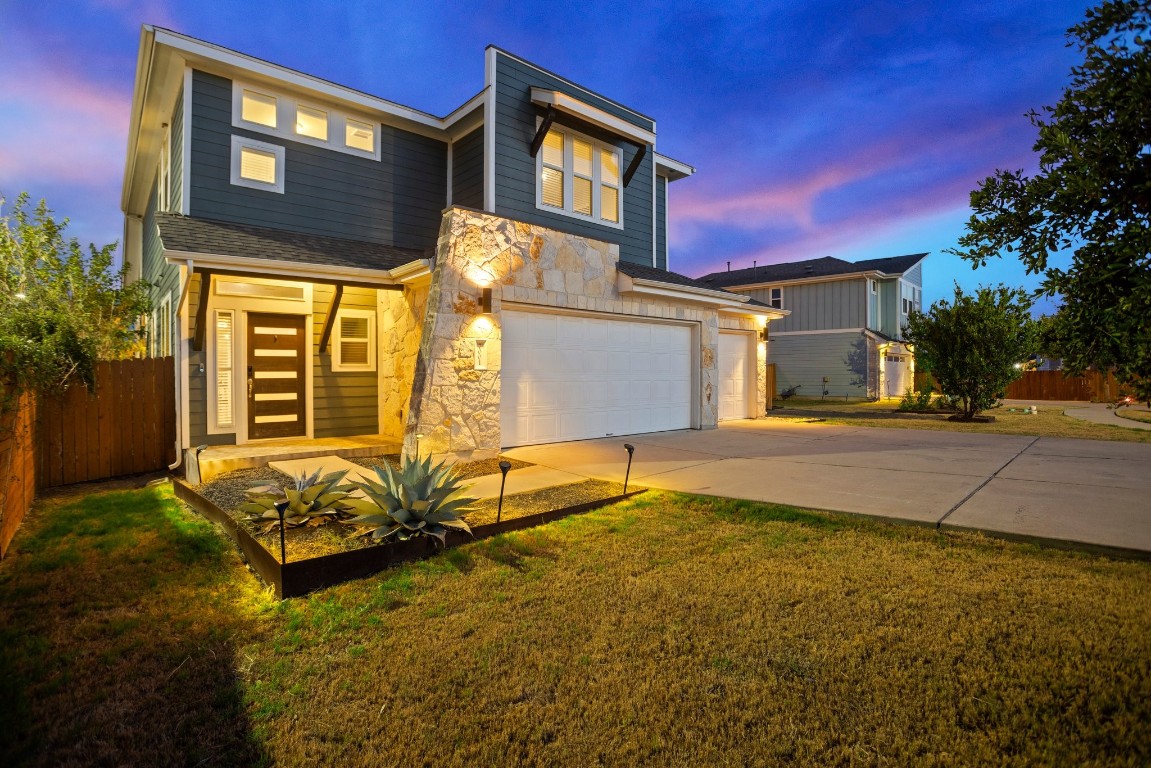 7001 Cherry Beam Path Austin, TX 78744 - Photo 1 of 1 a front view of a house with a yard