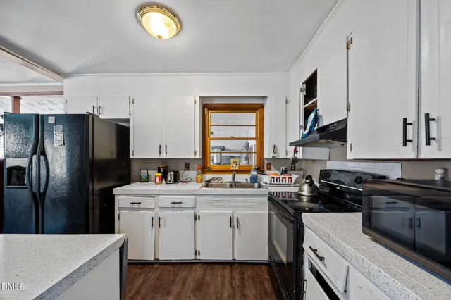 a kitchen with stainless steel appliances a sink stove and refrigerator