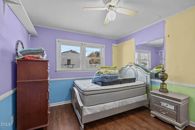 a bedroom with furniture and a window