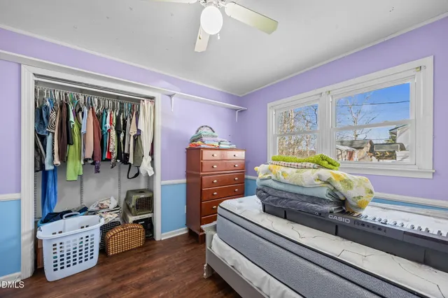 a bedroom with a bed and window