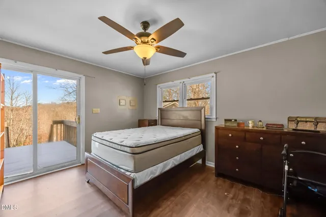 a bed room with a bed and a large mirror