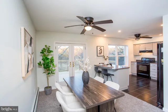 a kitchen with a sink stainless steel appliances and cabinets