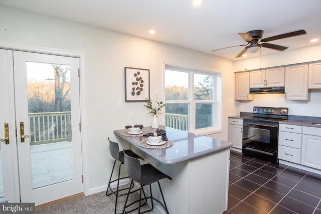 a kitchen with a sink stainless steel appliances and cabinets