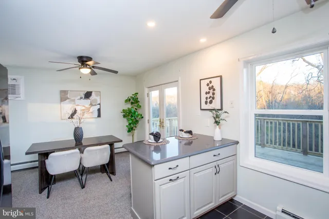 a bedroom with a bed and a potted plant