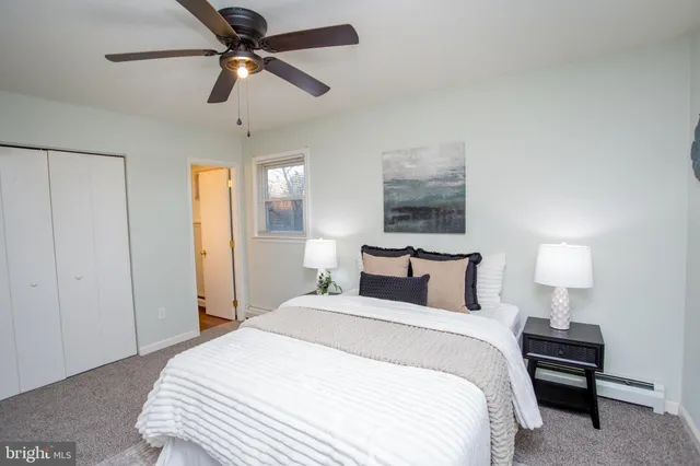 a bathroom with a sink mirror and vanity