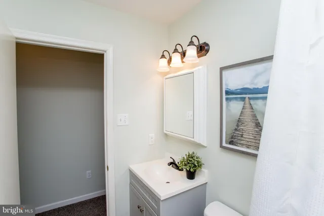 a bedroom with a bed and a table in it