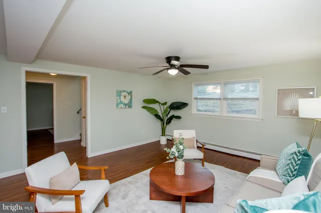 a view of a balcony with wooden floor and fence