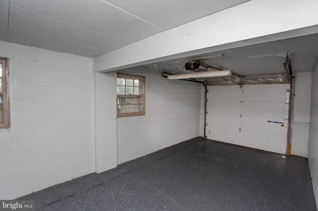 an aerial view of residential houses with outdoor space and river