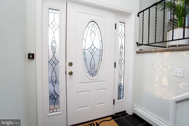a view of living room with furniture and a potted plant