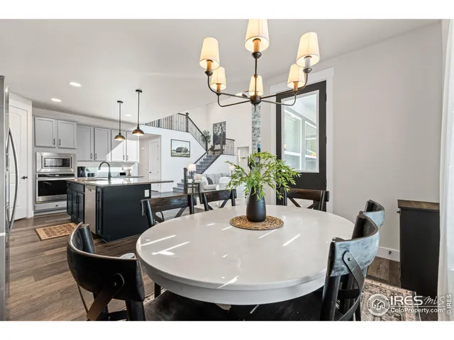 a kitchen with a table and chairs