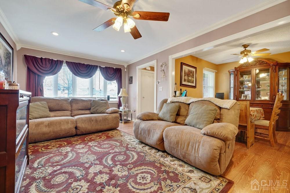 16 Gurley Road Edison, NJ 08817 - Photo 8 of 25 a living room with furniture and a chandelier
