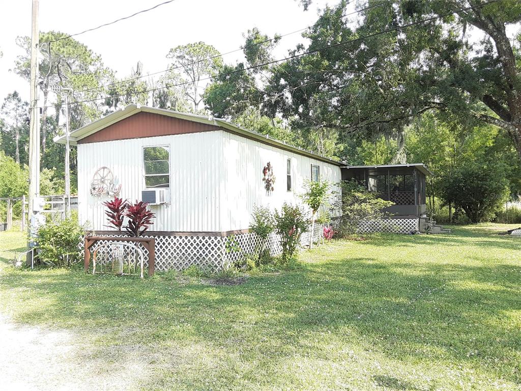 8333 Kathleen Road Lakeland, FL 33810 - Photo 18 of 24 a front view of a house with a yard