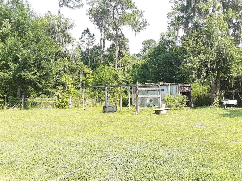 8333 Kathleen Road Lakeland, FL 33810 - Photo 19 of 24 a view of a swimming pool and a yard
