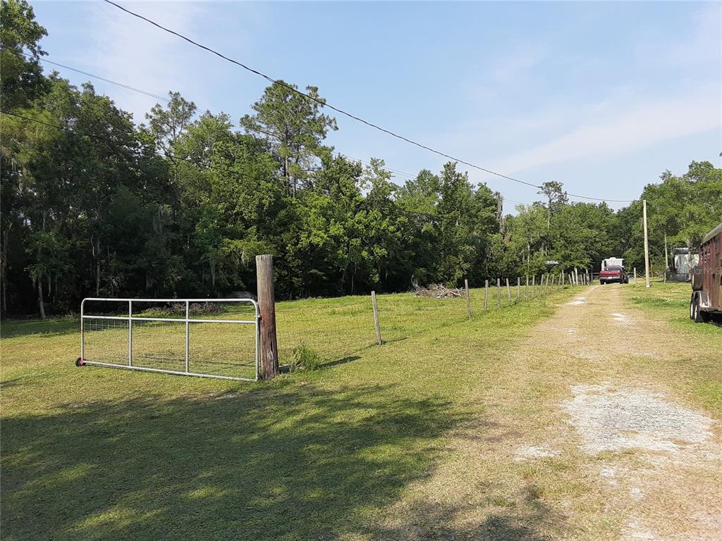 8333 Kathleen Road Lakeland, FL 33810 - Photo 2 of 24 a view of a swimming pool with a yard