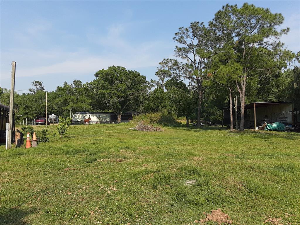 8333 Kathleen Road Lakeland, FL 33810 - Photo 22 of 24 a view of outdoor space with deck and yard