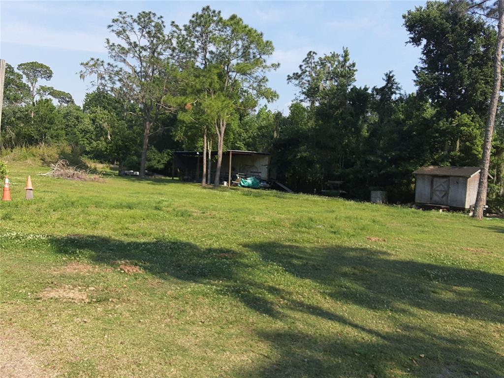 8333 Kathleen Road Lakeland, FL 33810 - Photo 23 of 24 a view of a backyard with a small cabin