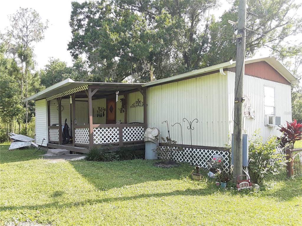 8333 Kathleen Road Lakeland, FL 33810 - Photo 6 of 24 a view of a front of a house with a garage