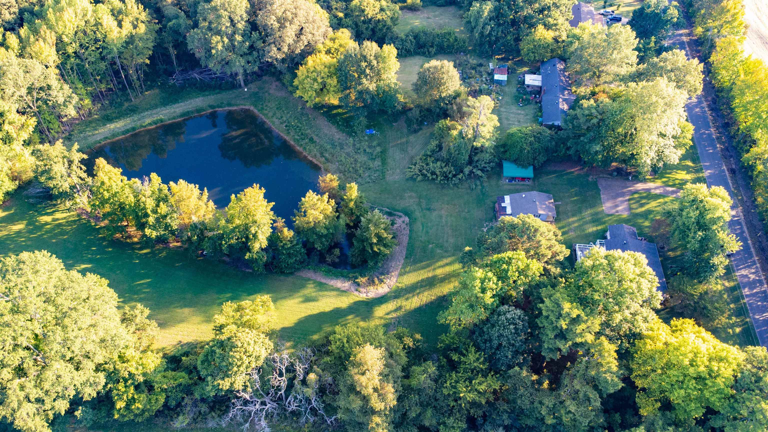 3758 Craig Road Ripley, TN 38063 - Photo 36 of 37 a view of a lake with a yard