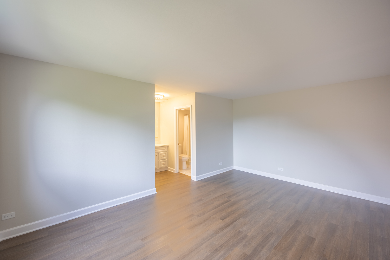 450 Raintree Court, Unit 2B Glen Ellyn, IL 60137 - Photo 14 of 28 a view of an empty room and wooden floor
