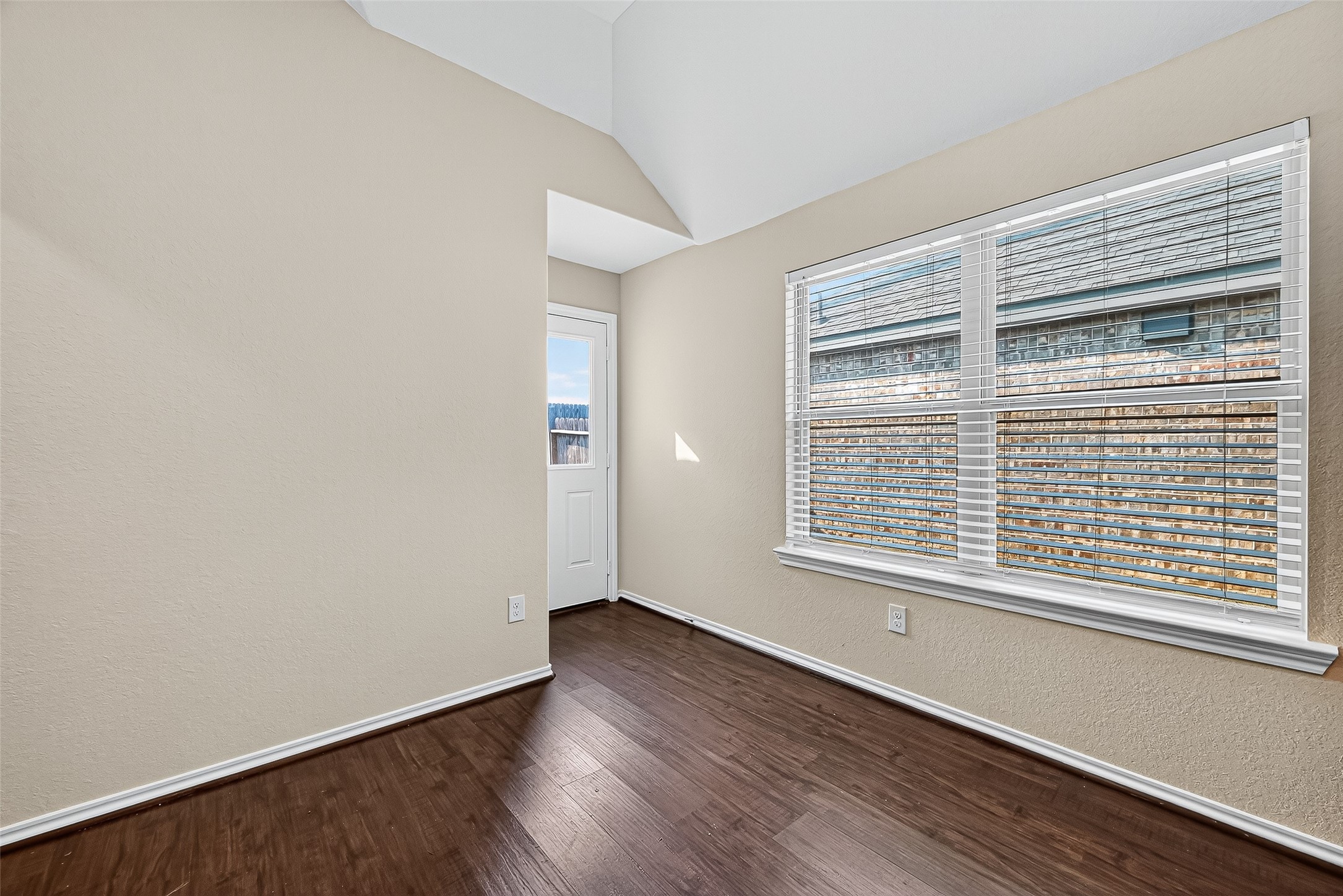 5603 Savanna Pasture Road Katy, TX 77493 - Photo 12 of 29 a view of an empty room with wooden floor and a window