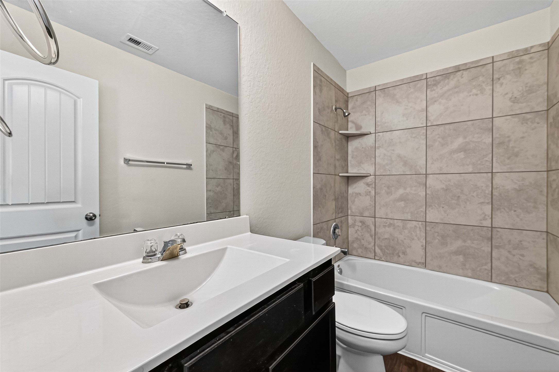 5603 Savanna Pasture Road Katy, TX 77493 - Photo 16 of 29 a bathroom with a sink toilet vanity and bathtub