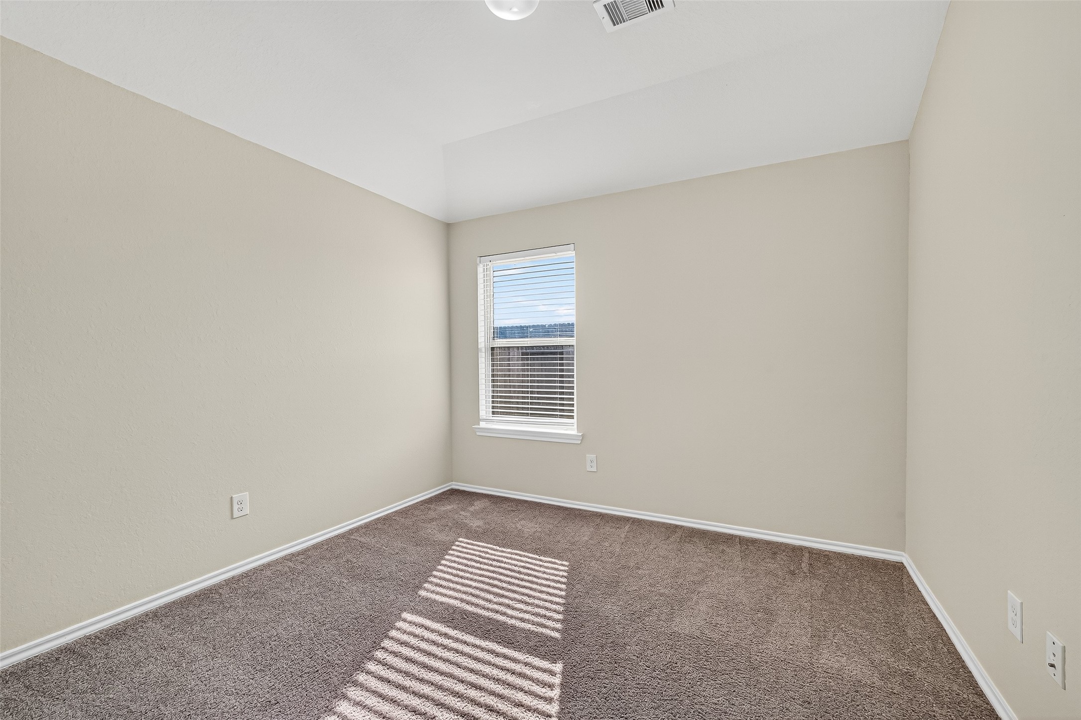 5603 Savanna Pasture Road Katy, TX 77493 - Photo 18 of 29 a view of an empty room with a window