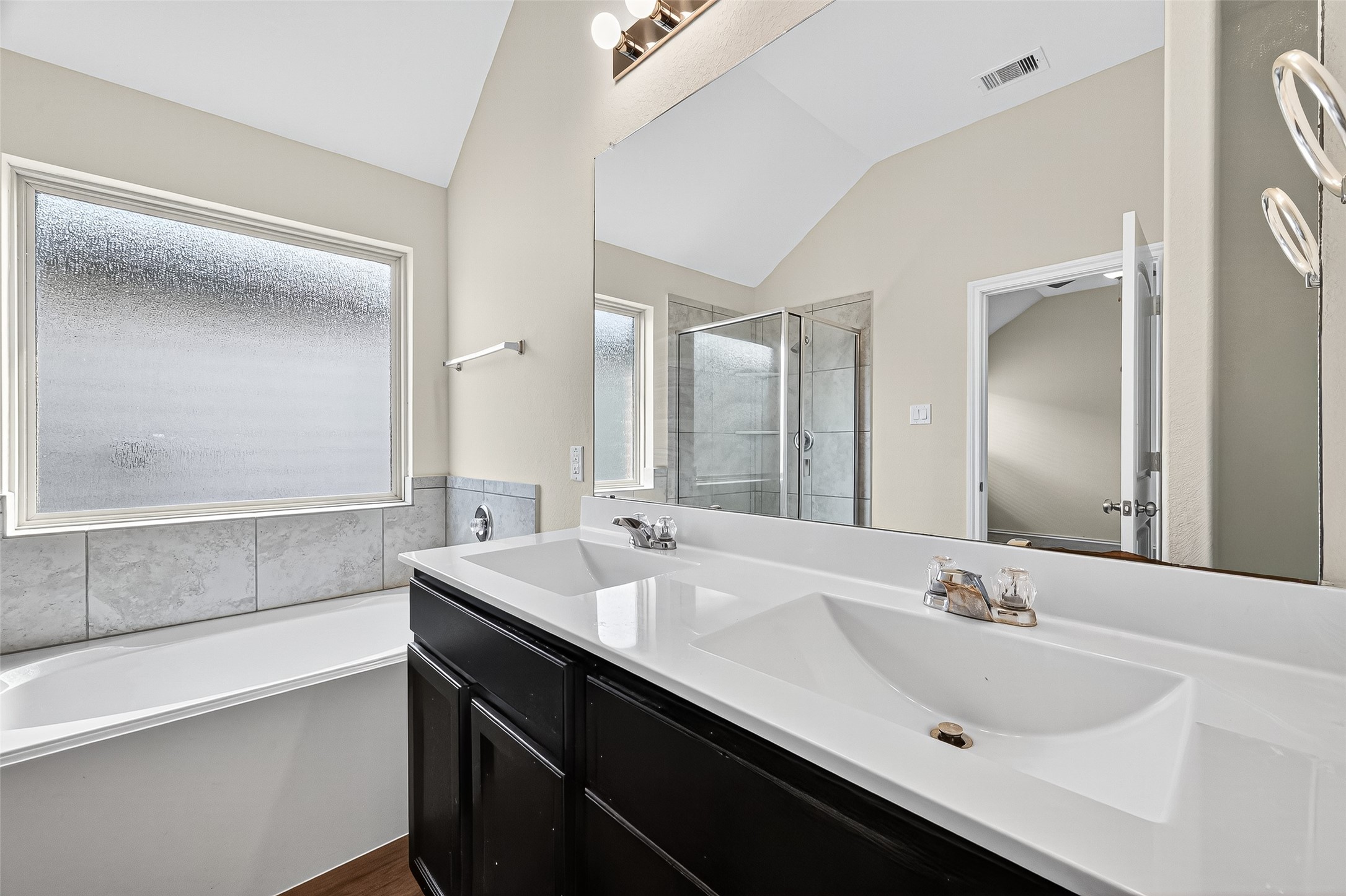 5603 Savanna Pasture Road Katy, TX 77493 - Photo 25 of 29 a bathroom with double sink and a mirror