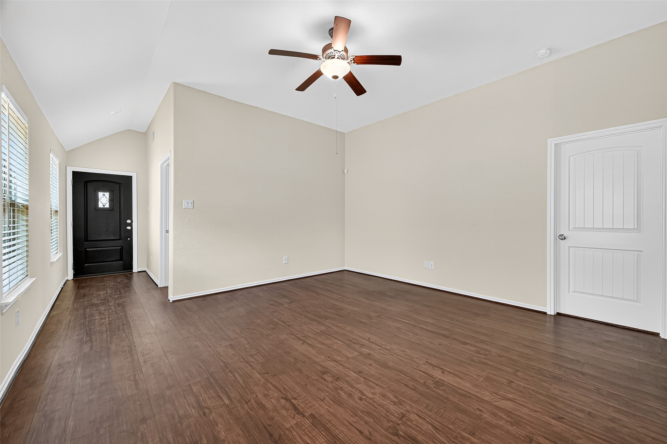 5603 Savanna Pasture Road Katy, TX 77493 - Photo 4 of 29 wooden floor in an empty room with a window