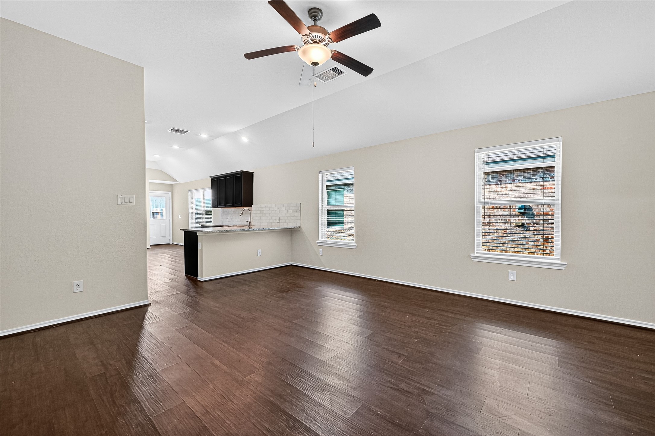 5603 Savanna Pasture Road Katy, TX 77493 - Photo 5 of 29 a view of an empty room with window and wooden floor