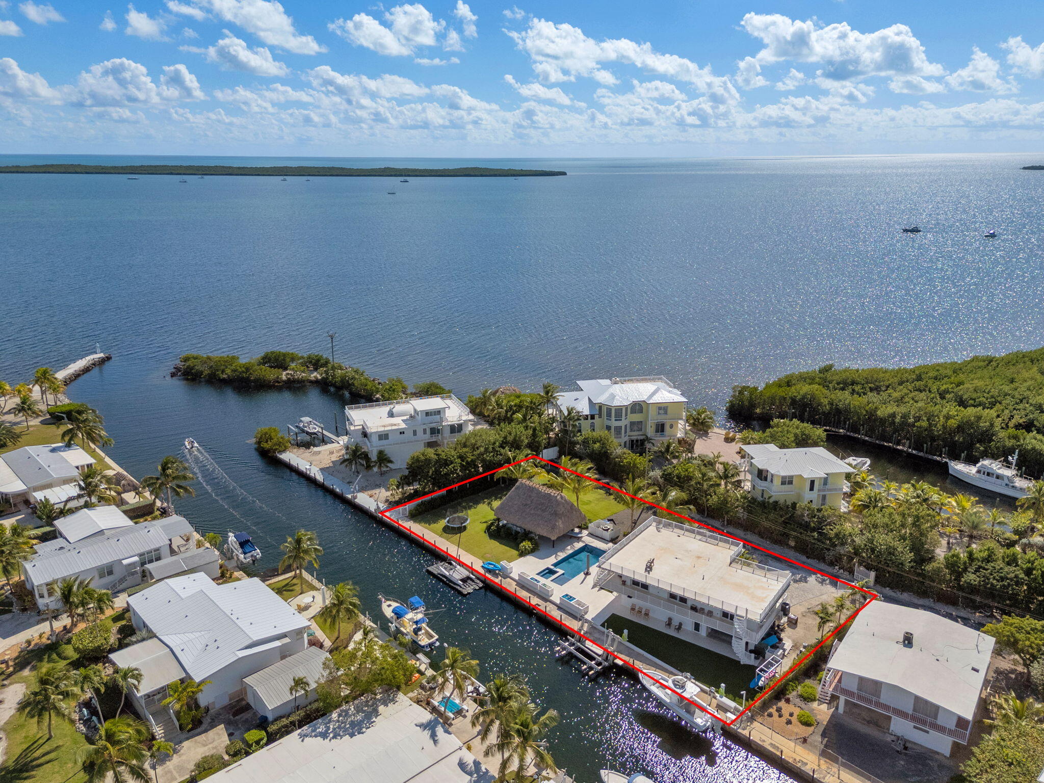 Undisclosed Address Key Largo, FL 33037 - Photo 1 of 56 an aerial view of residential houses with outdoor space