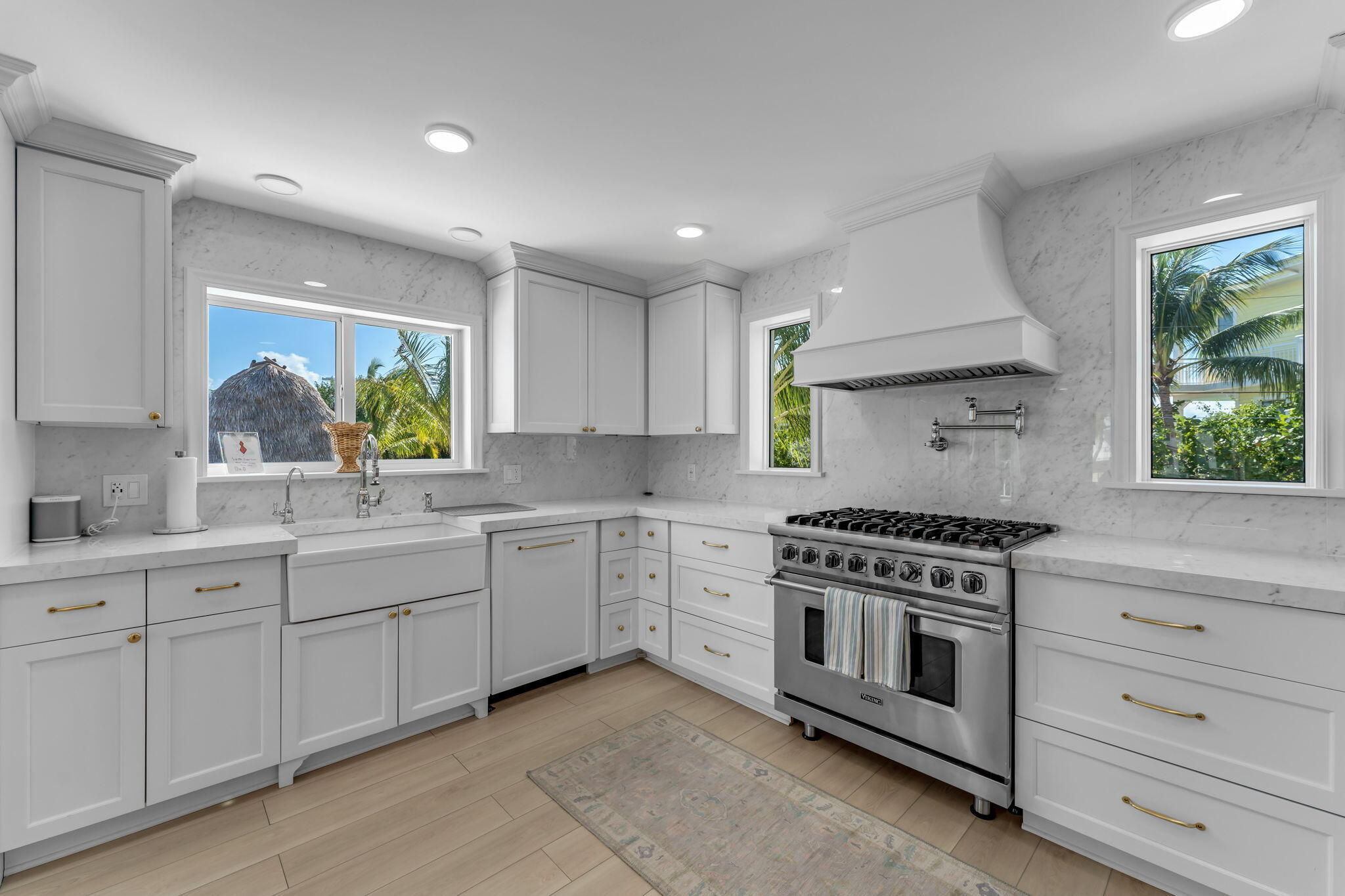 Undisclosed Address Key Largo, FL 33037 - Photo 11 of 56 a kitchen with stainless steel appliances granite countertop white cabinets and a stove top oven