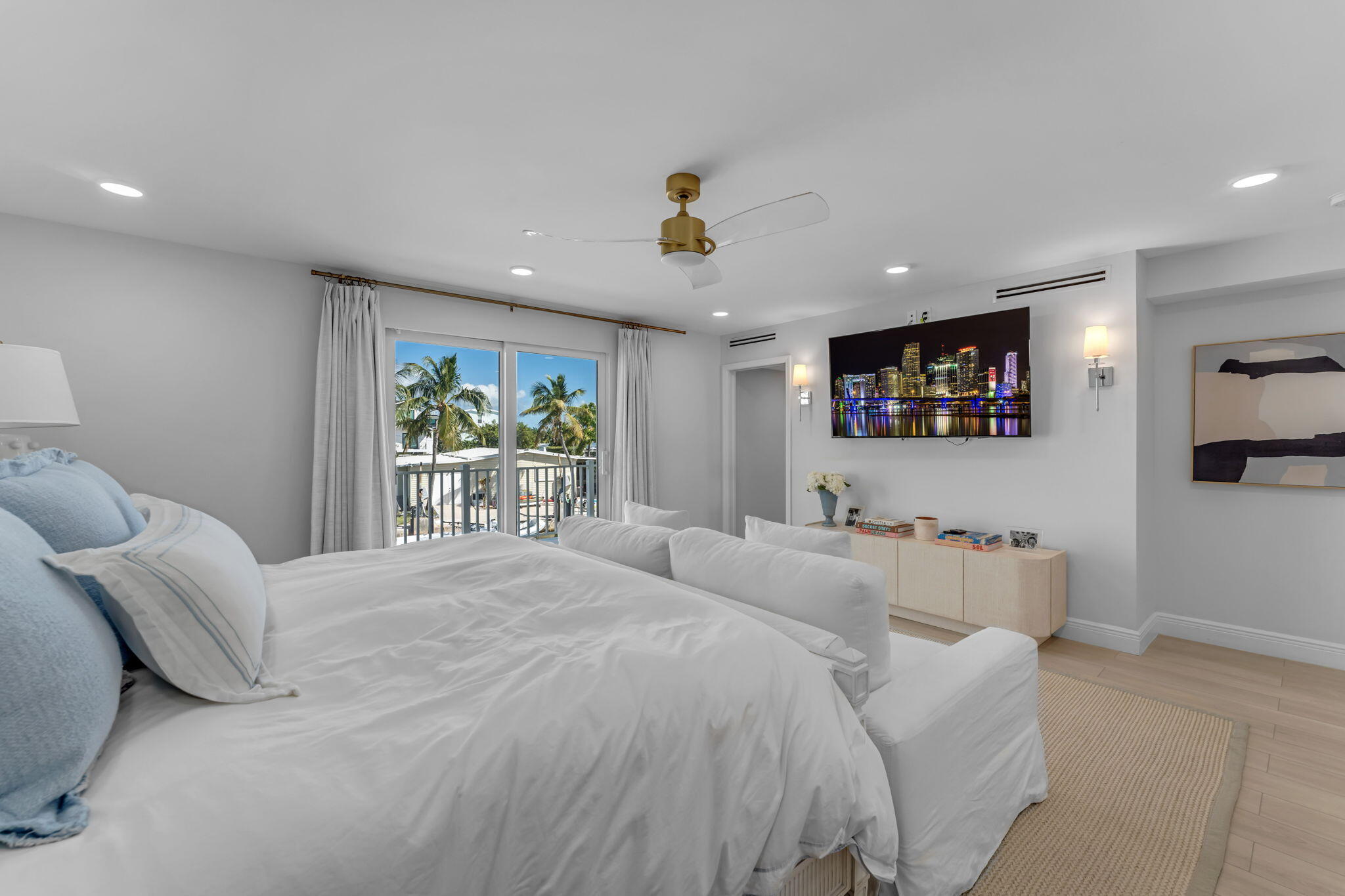 Undisclosed Address Key Largo, FL 33037 - Photo 22 of 56 a bedroom with a balcony a bed and painting on the wall