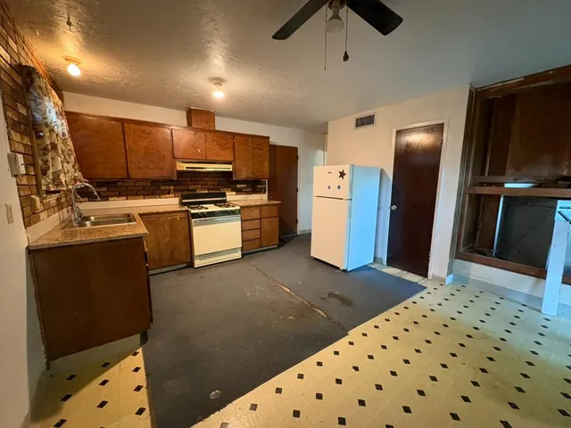 a view of an empty room with empty shelves