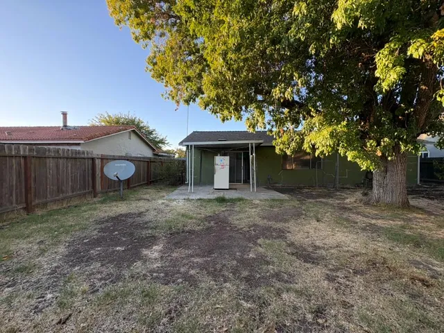 a view of backyard with green space