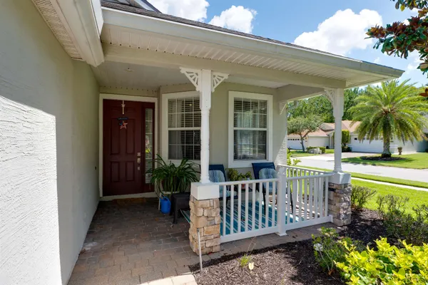 a view of a house with a small yard and plants