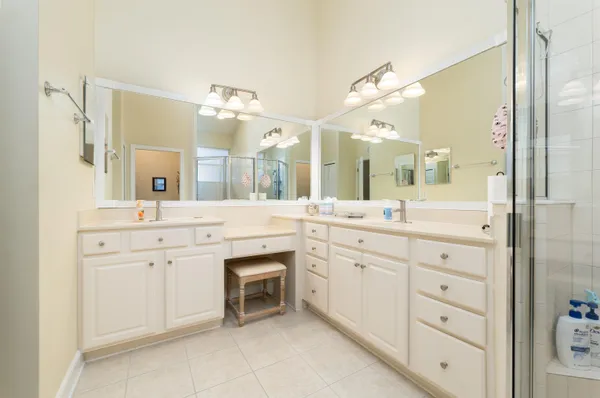 a spacious bathroom with a granite countertop sink mirror and